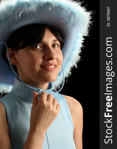 Brunette girl with cowboy hat, isolated on black