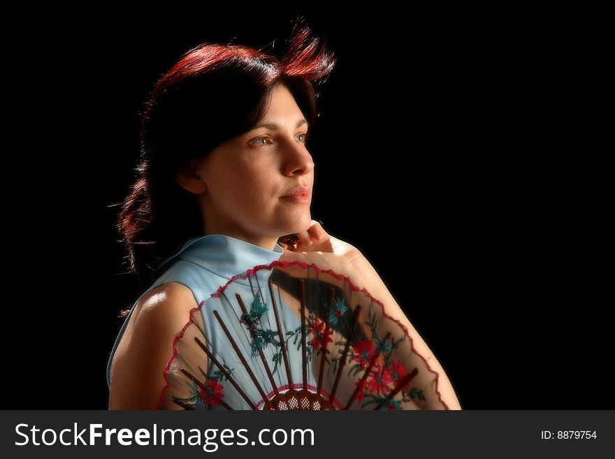 Young woman with spanish fan