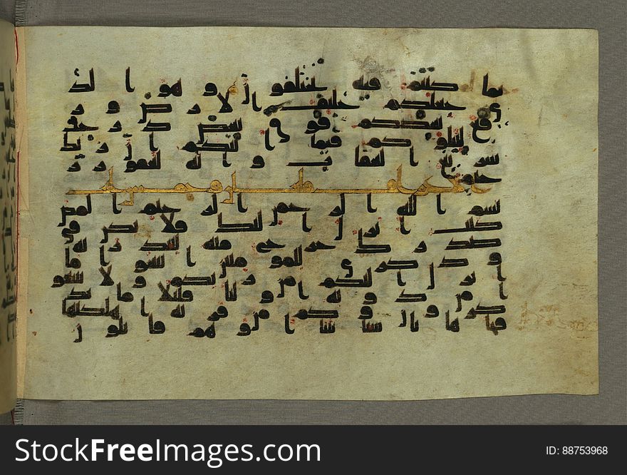This horizontal-format manuscript on parchment is an illuminated fragment of the Qur&#x27;an, covering chapter 6 &#x28;SÅ«rat al-anÊ¿Äm&#x29;, the end of verse 54, through chapter 9 &#x28;SÅ«rat al-tawbah&#x29;, verse 79. The fragment probably dates to the third century AH / ninth CE. The text is written in an Early Abbasid &#x28;Kufic&#x29; script in dark brown ink and vocalized with red dots. Chapter headings are in gold ink, and verse markers in the shape of a stylized letter hÄ&#x27; and rosettes with colored dots indicate groups of five and ten verses. The green goatskin binding with gold-painted central floral design and cornerpieces is thirteenth century AH / nineteenth CE or later. See this manuscript page by page at the Walters Museum Website: art.thewalters.org/viewwoa.aspx?id=1528. This horizontal-format manuscript on parchment is an illuminated fragment of the Qur&#x27;an, covering chapter 6 &#x28;SÅ«rat al-anÊ¿Äm&#x29;, the end of verse 54, through chapter 9 &#x28;SÅ«rat al-tawbah&#x29;, verse 79. The fragment probably dates to the third century AH / ninth CE. The text is written in an Early Abbasid &#x28;Kufic&#x29; script in dark brown ink and vocalized with red dots. Chapter headings are in gold ink, and verse markers in the shape of a stylized letter hÄ&#x27; and rosettes with colored dots indicate groups of five and ten verses. The green goatskin binding with gold-painted central floral design and cornerpieces is thirteenth century AH / nineteenth CE or later. See this manuscript page by page at the Walters Museum Website: art.thewalters.org/viewwoa.aspx?id=1528
