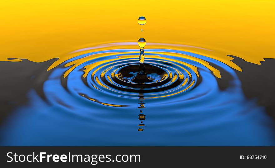 Drops falling in the water making rings. Drops falling in the water making rings.