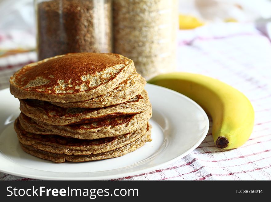Pile of pancakes for breakfast with ripe banana. Pile of pancakes for breakfast with ripe banana.
