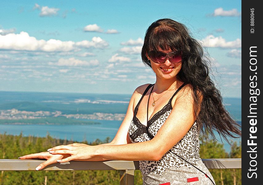 Smiling girl in sunglasses above Ural valley. Smiling girl in sunglasses above Ural valley.