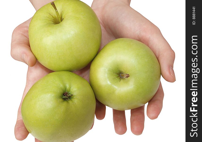 Color photograph hand holding a green apple on a white background. Color photograph hand holding a green apple on a white background