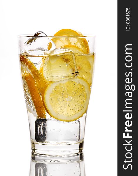 Glass with fizzy liquid and lemon slice. Glass with fizzy liquid and lemon slice