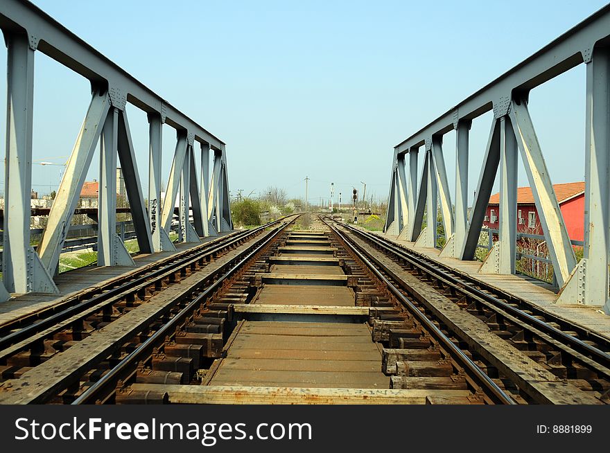 A view with a railroad and a bridge