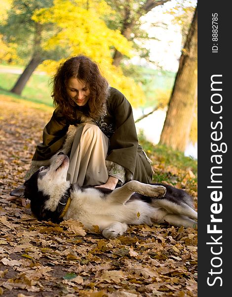 Lady in medieval dress and dog in the forest. Lady in medieval dress and dog in the forest