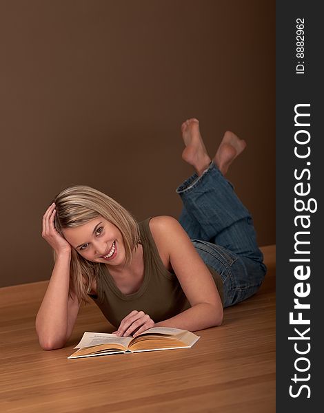 Blond young woman reading book. Blond young woman reading book