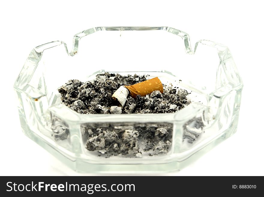 The extinguished cigarette in an ashtray