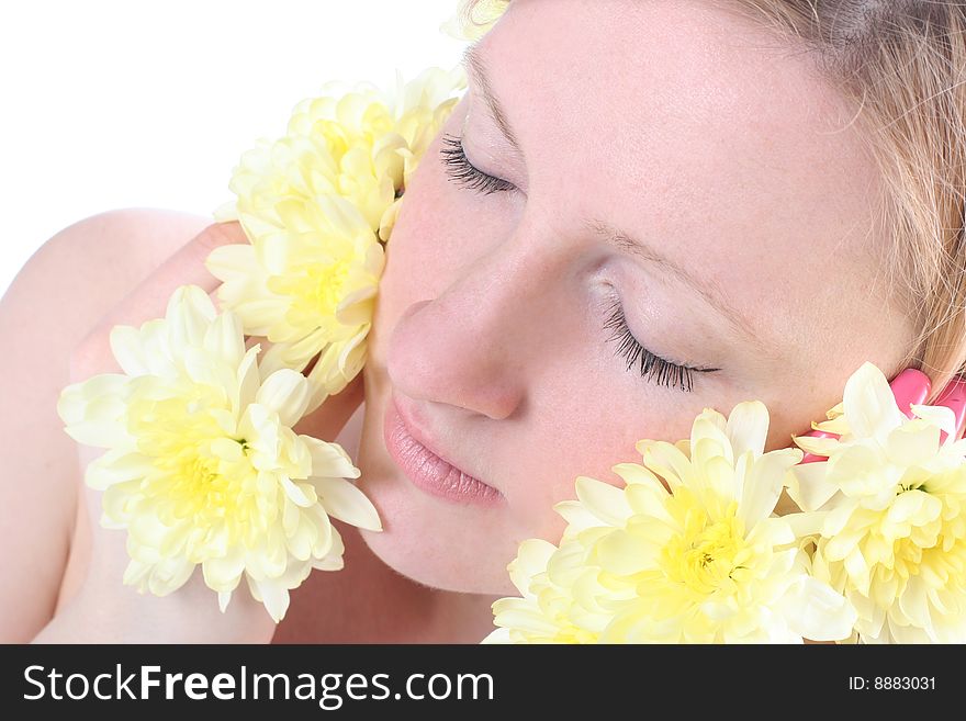 Close-up portrait of beautiful blond girl with yellow flowers. Close-up portrait of beautiful blond girl with yellow flowers