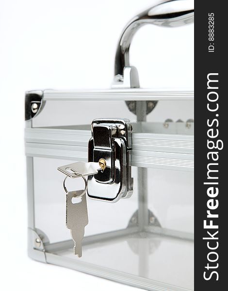 Small cosmetic  suitcase closed on the lock. Small cosmetic  suitcase closed on the lock