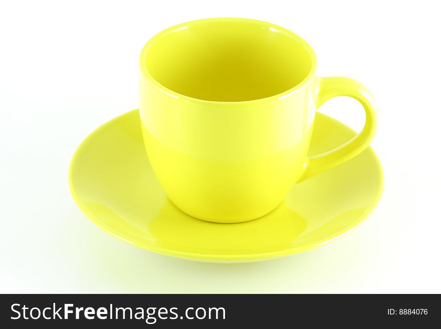 Empty yellow cup, isolated over white board