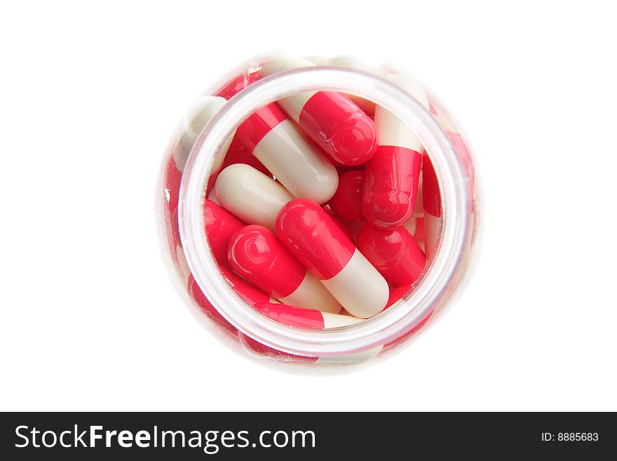 Red-white pills on a white background