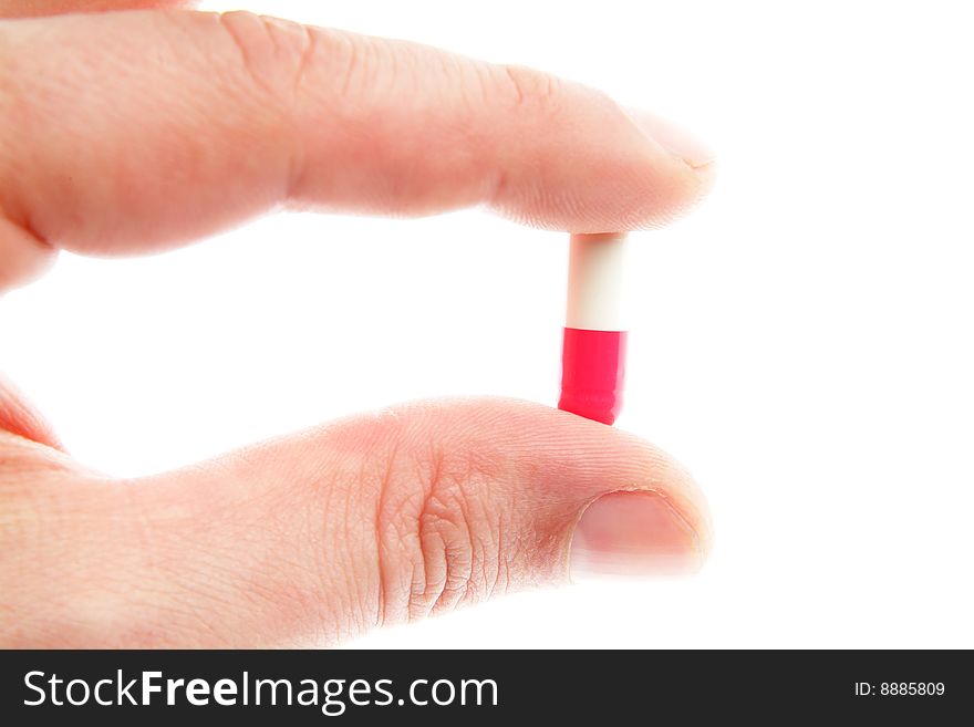 Red-white pills on a white background