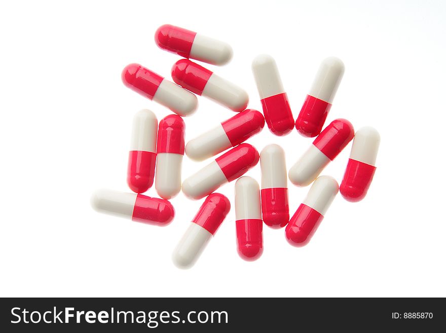 Red-white pills on a white background