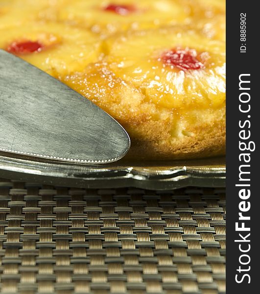 Homemade pineapple cake on a plate focus on the utensil. Homemade pineapple cake on a plate focus on the utensil