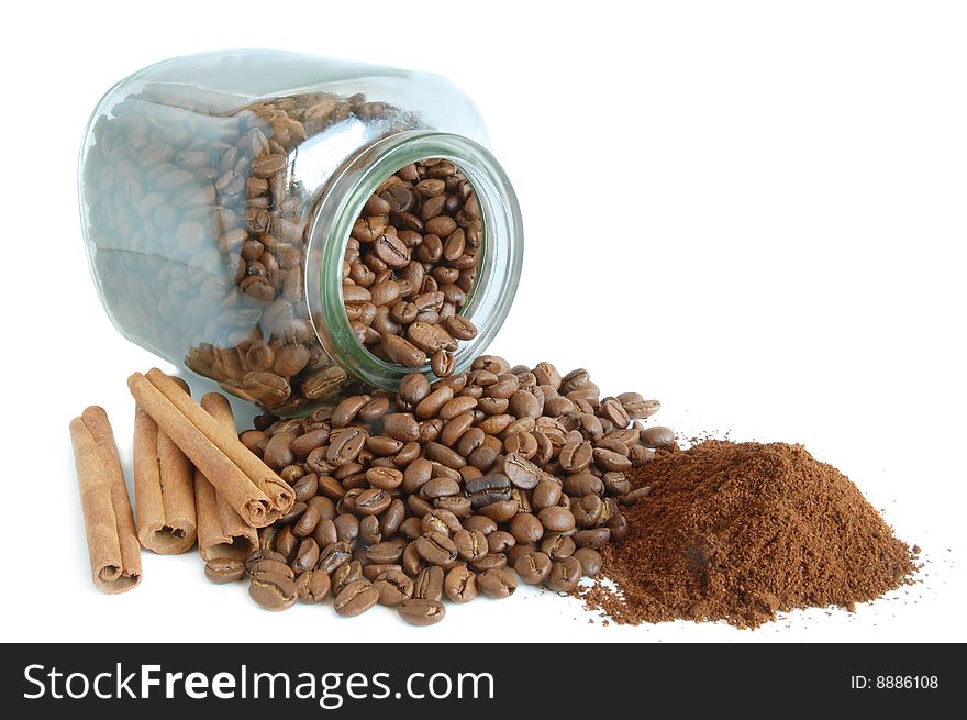 Ground coffee and beans on white background