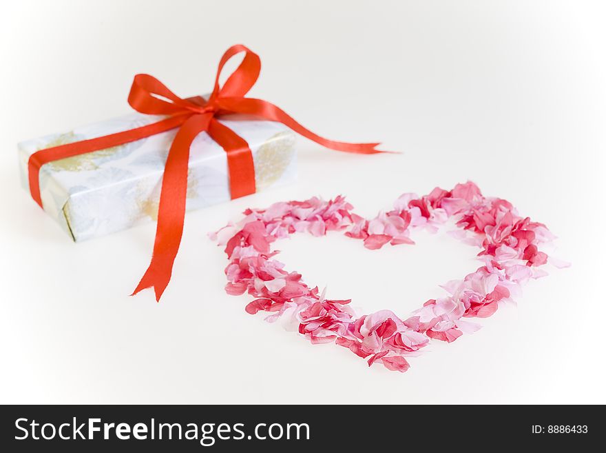 Petals shaped as a heart with gift box.