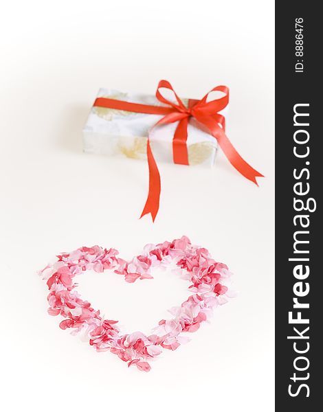 Petals shaped as a heart with gift box.