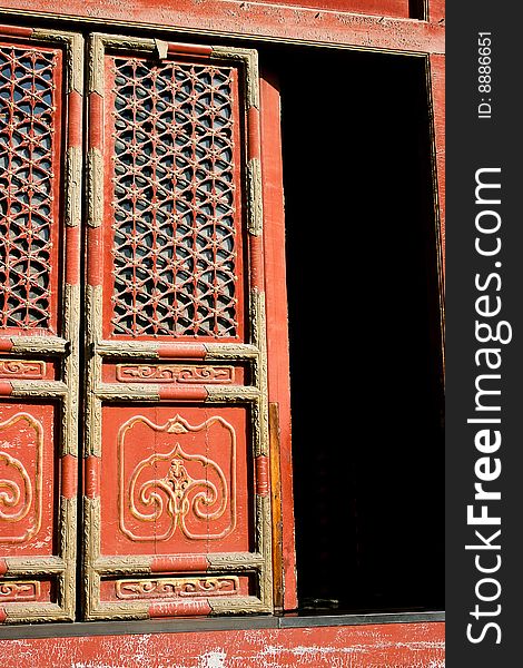 Detail of an ornamented door in a Chinese Buddhist temple in Beijing