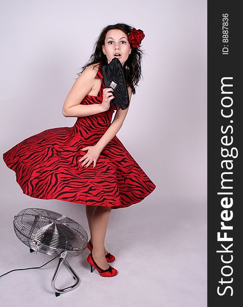 Pinup Girl Standing Near A Ventilator