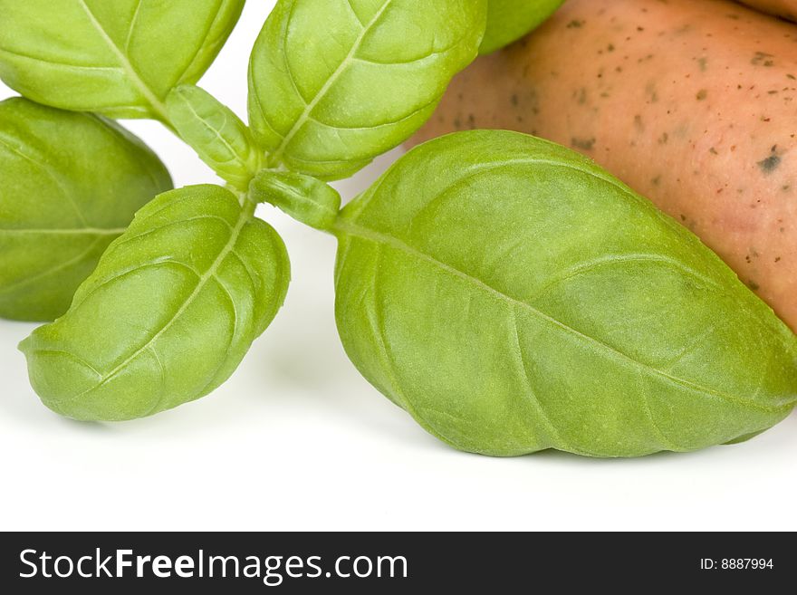 Close up of sausages with basil. Close up of sausages with basil