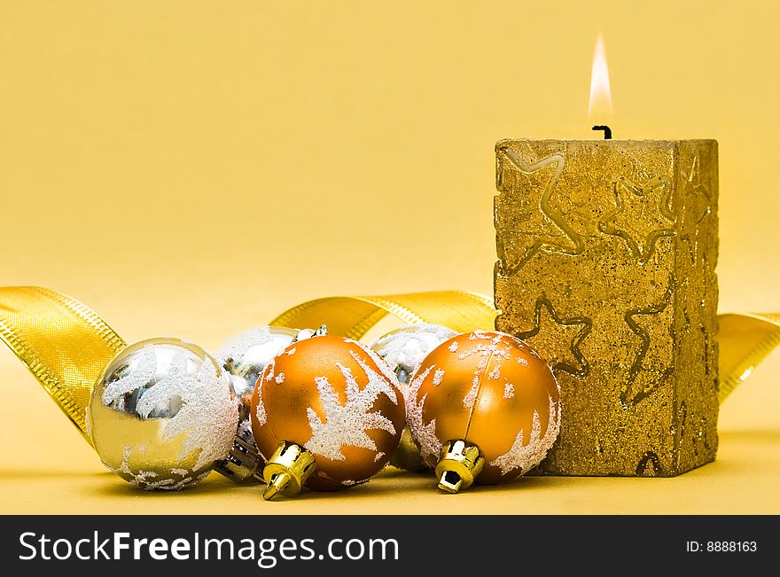 Golden candle and Christmas balls