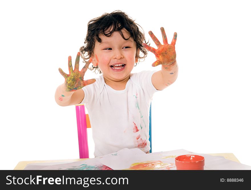 Little boy painting with paints for hands