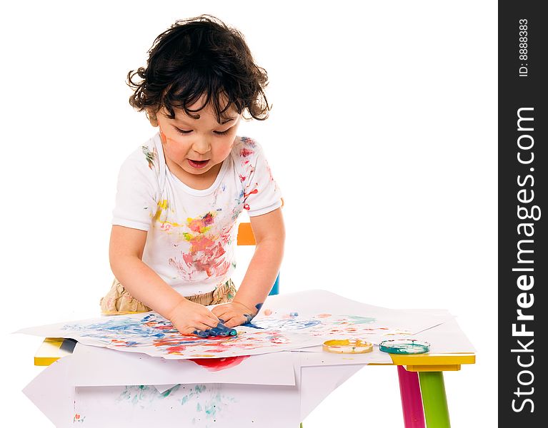 Little boy painting with paints for hands