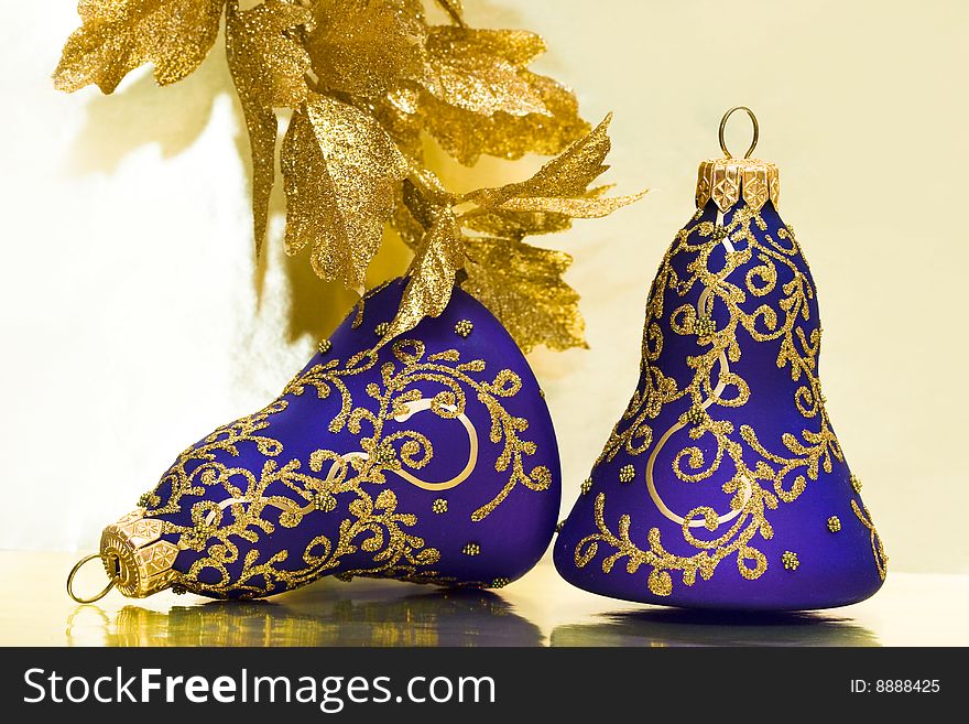 Violet celebration bells and golden leaves