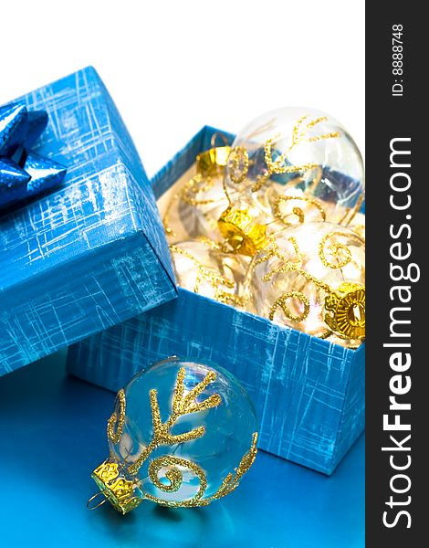 Many Christmas balls in blue gift box
