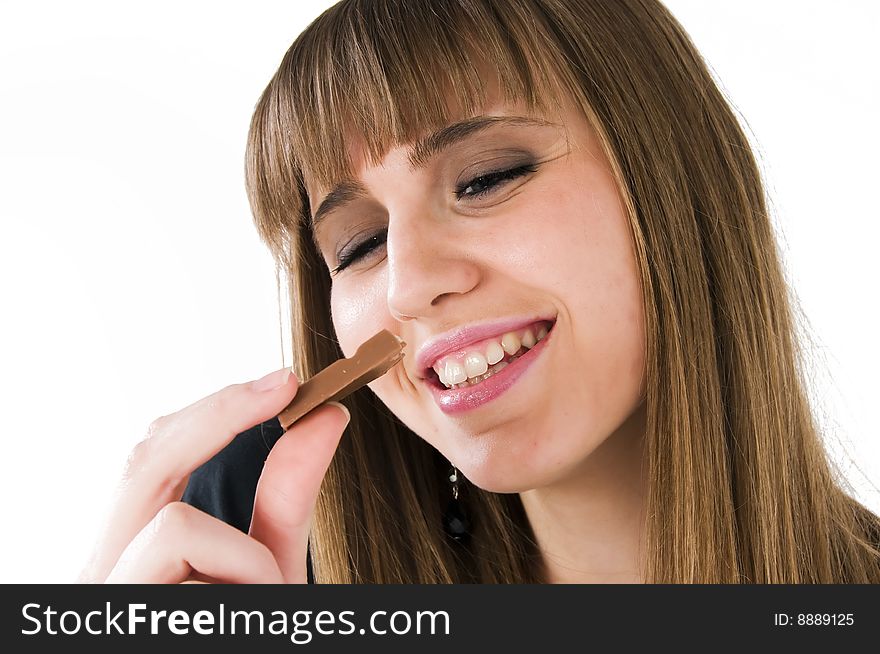 Young girl with chocolate in mouth. Young girl with chocolate in mouth.