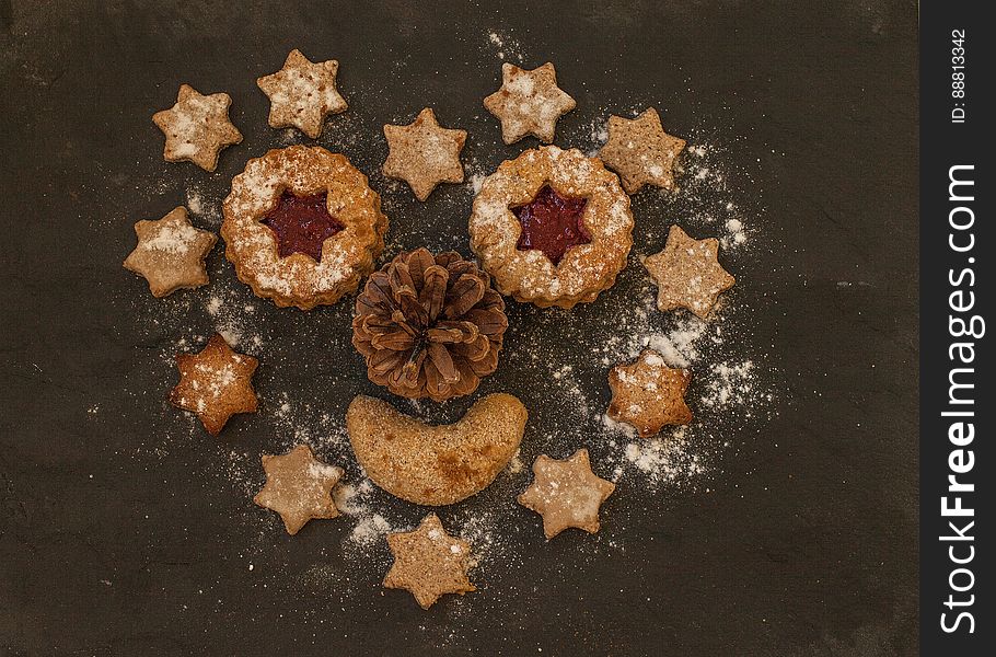 Christmas gingerbread cookies in a heart shape with a pinecone in the middle. Christmas gingerbread cookies in a heart shape with a pinecone in the middle.