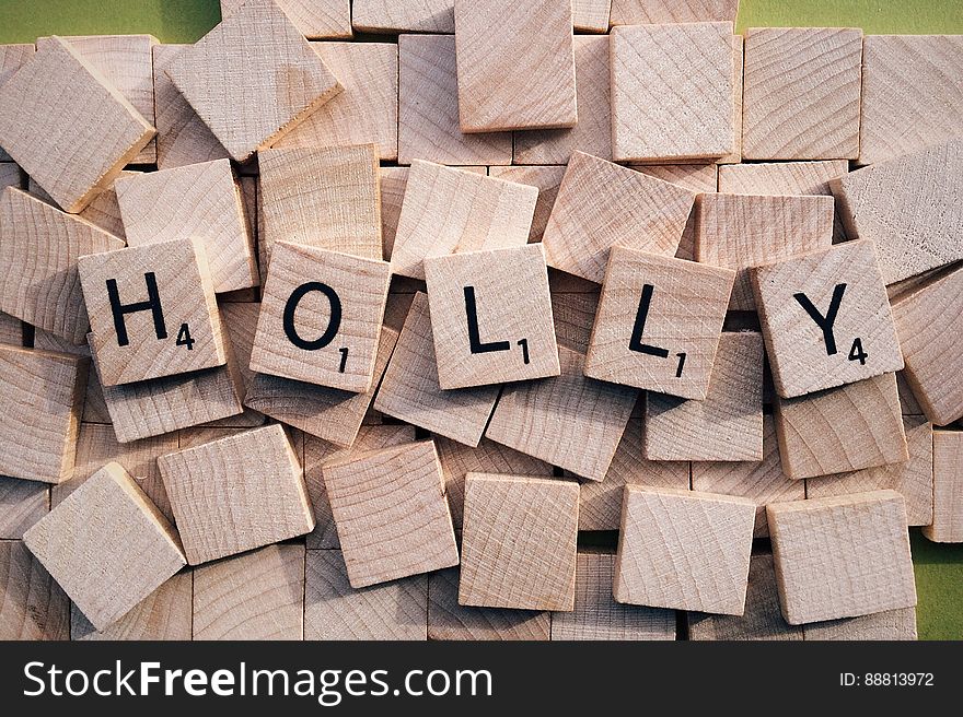A close up of name Holly in wooden cubes.