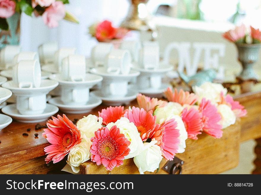Set Of Coffee Cups And Flower Arrangement