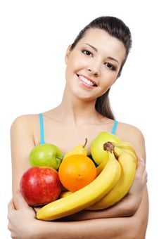 Laughing Young Woman With Fruits Royalty Free Stock Image