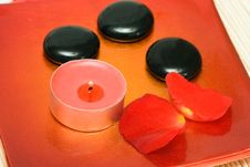 Candle, Stones And Petals Royalty Free Stock Photo