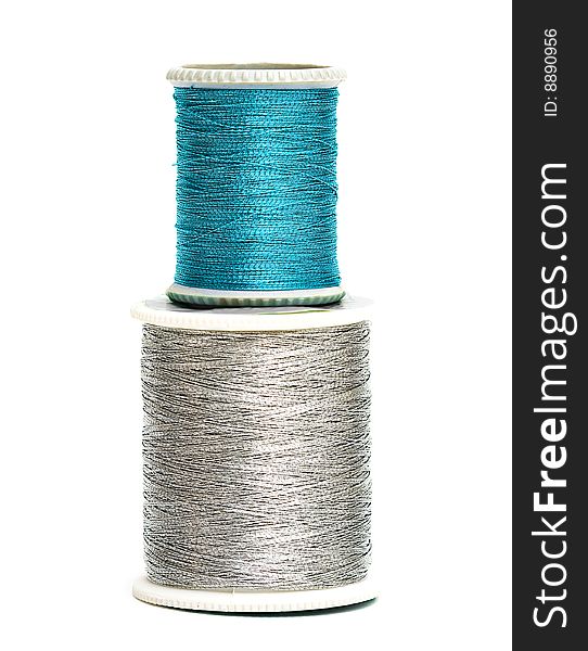 Blue and silver spools of threads