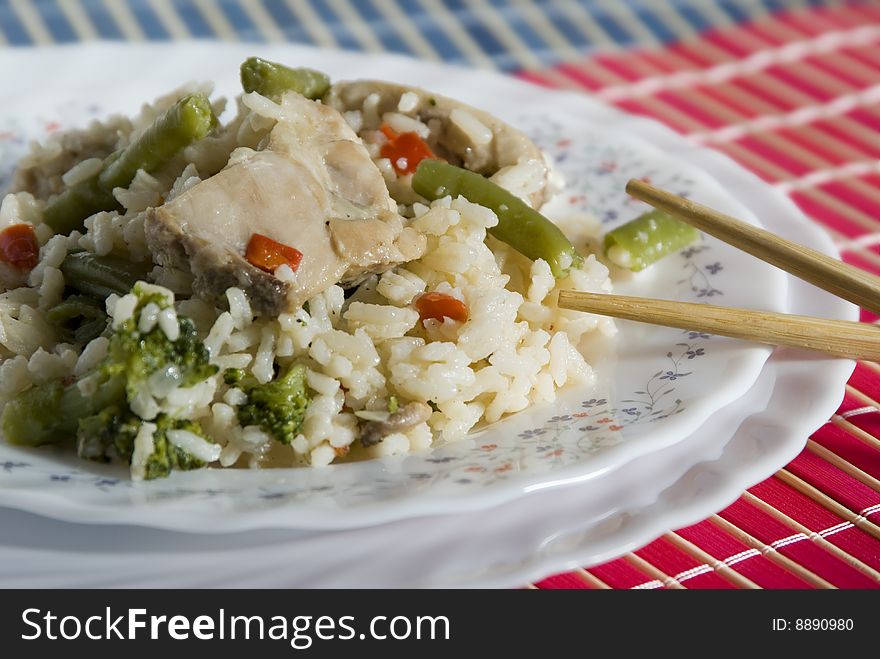 chinese-style dish with rice and chicken pieces. chinese-style dish with rice and chicken pieces