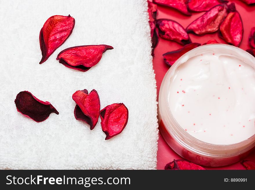 Cream and towel with red petals