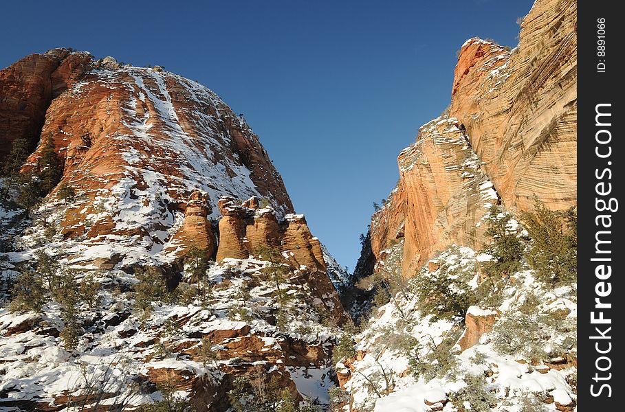 Snow, red rocks. Zion National Park, Cold country awesome scenery- Southern Utah- blue skies, canyon, cliff, icicle, Christmas 2008, trees. Snow, red rocks. Zion National Park, Cold country awesome scenery- Southern Utah- blue skies, canyon, cliff, icicle, Christmas 2008, trees