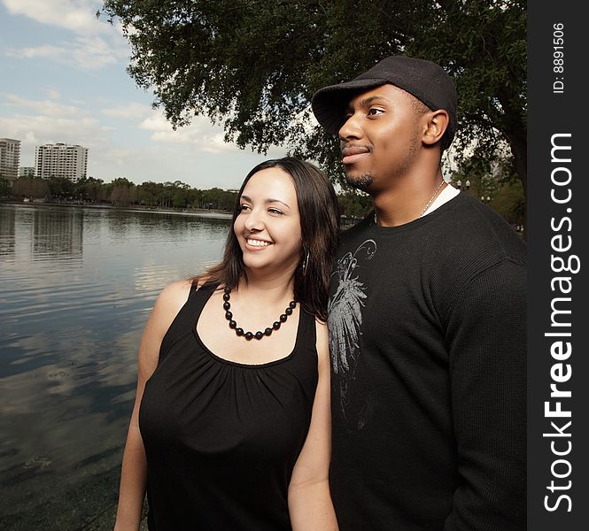 Young Couple By The Lake