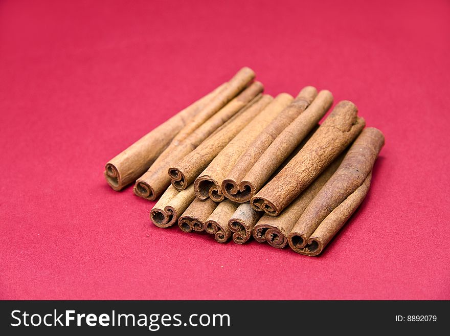 Cinnamon Sticks On Red- Tight Depth Of Field