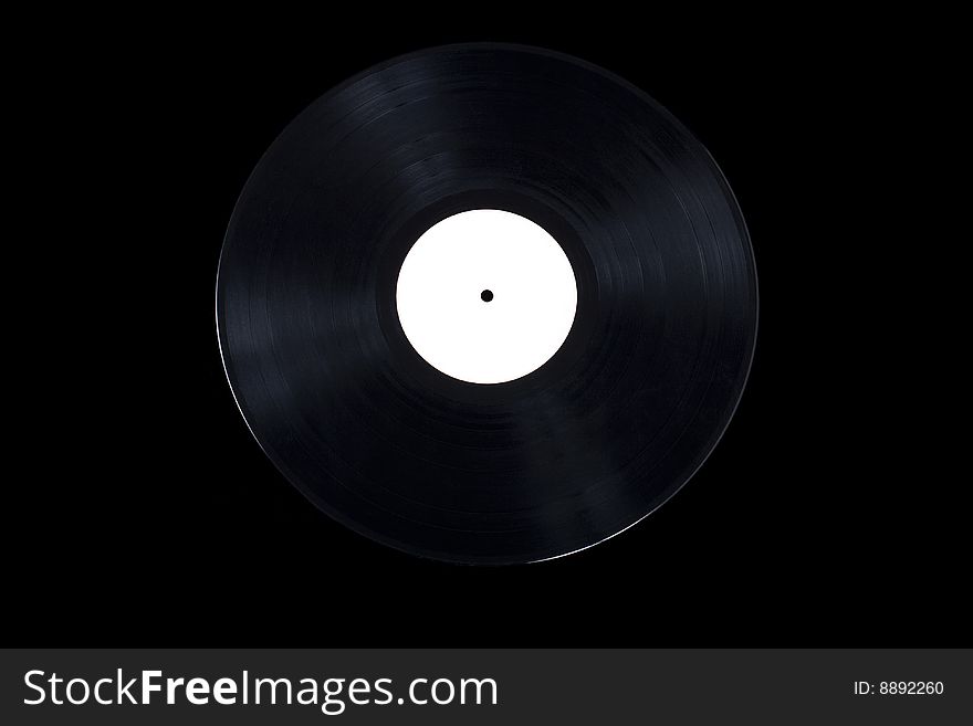 Antique vinyl record on black background