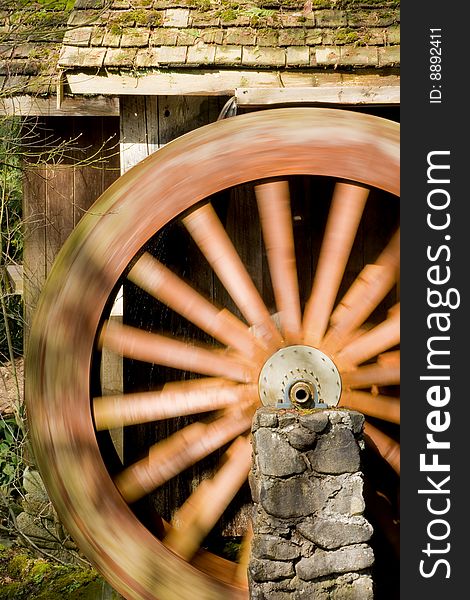 Spinning grist mill water wheel