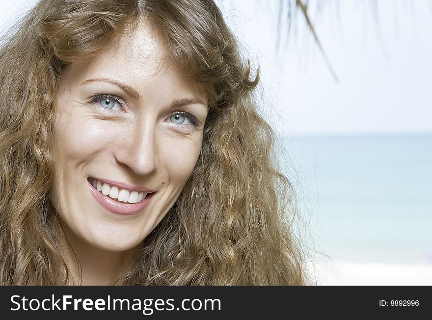 Portrait of nice young woman having good time on the beach. Portrait of nice young woman having good time on the beach