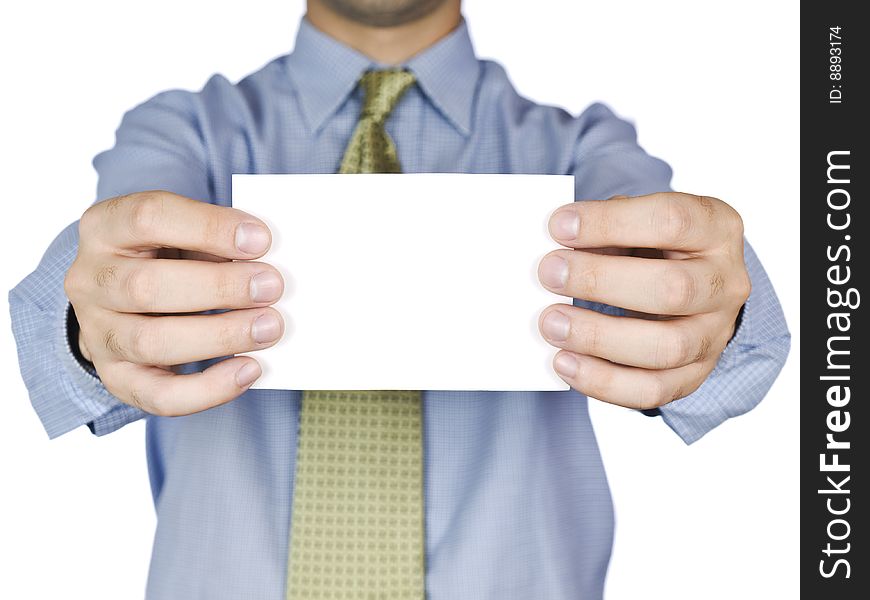 Business man holding a blank white card (focus on the card). Isolated on white.