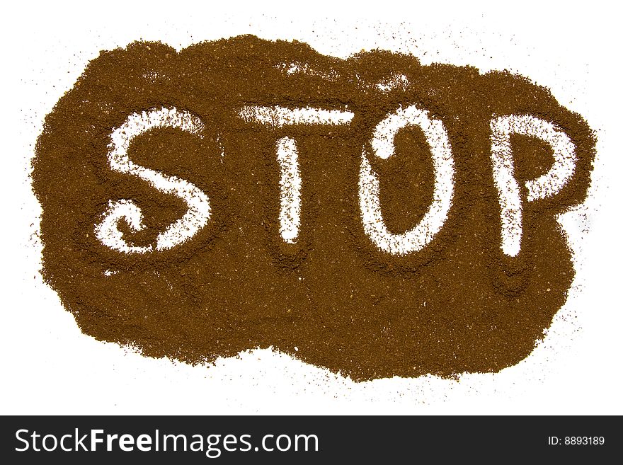 Word stop written in ground coffee