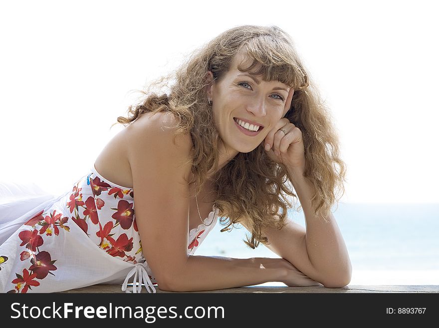 Portrait of nice young woman having good time on the beach. Portrait of nice young woman having good time on the beach
