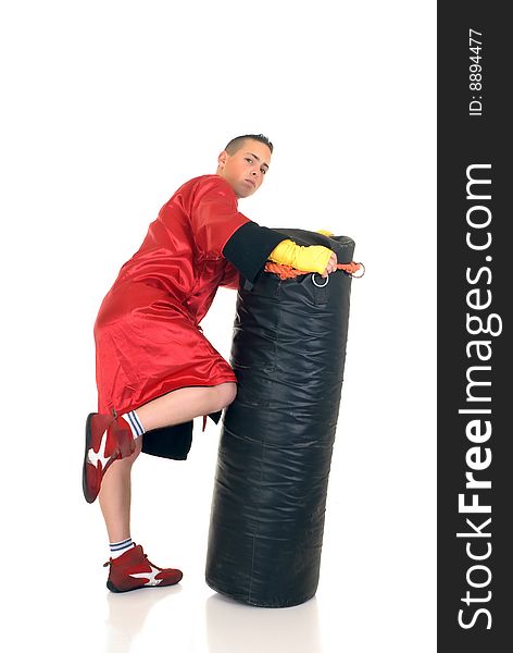 Youngster practicing the art of boxing with a punch-bag, studio shot on white background
