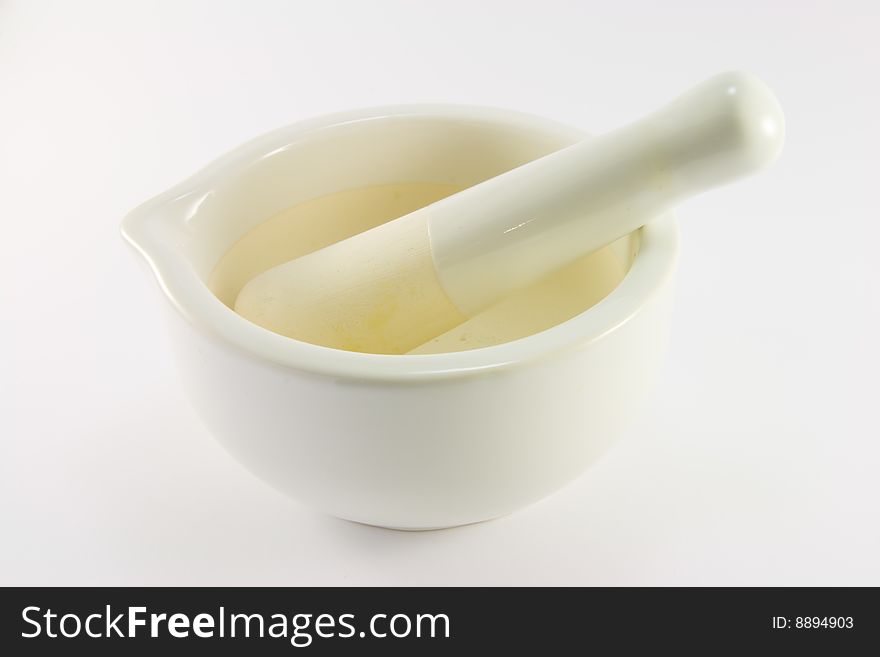 White stone mortar and pestle on a white background